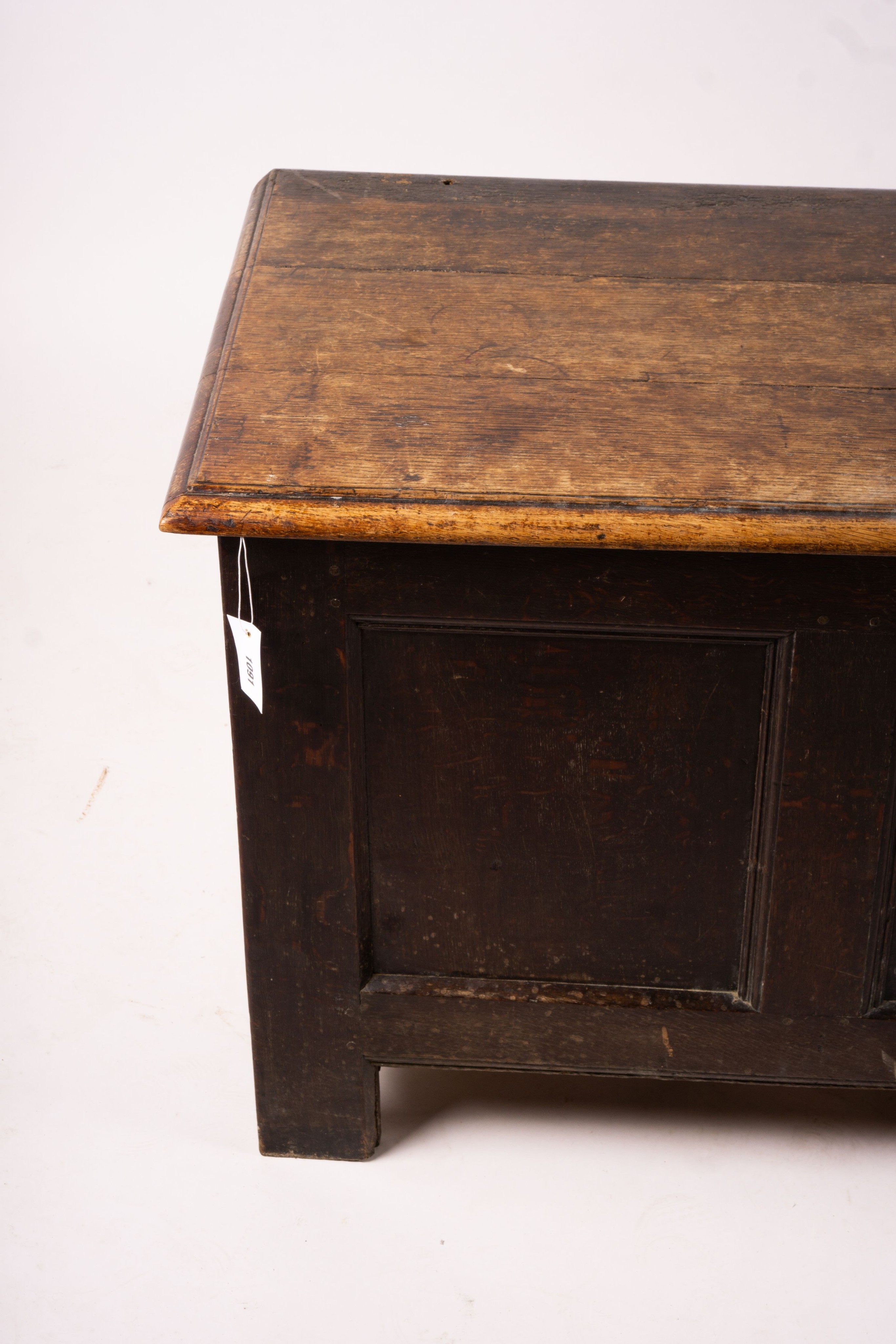 A 17th century panelled oak coffer, length 136cm, depth 56cm, height 64cm